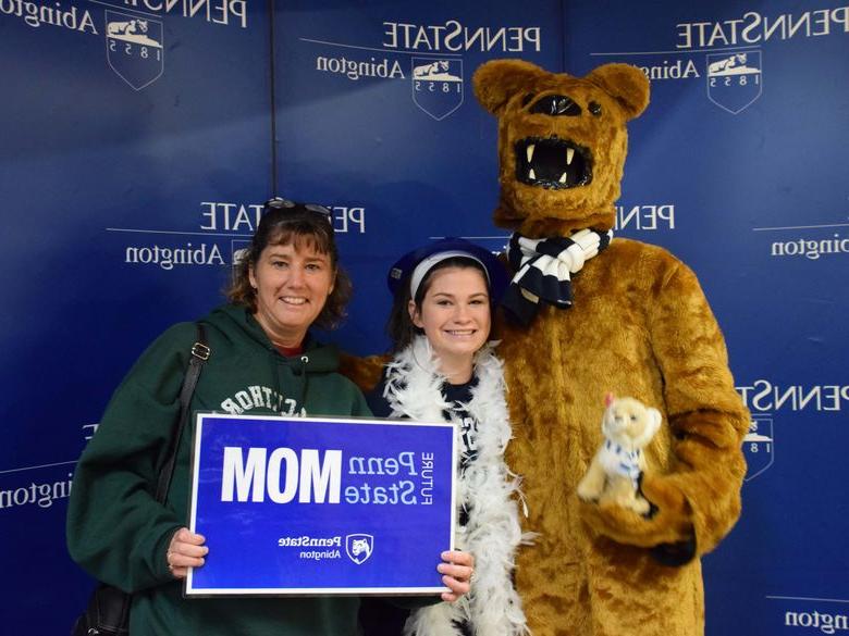 Mother and daughter posing with Nittany lion 
